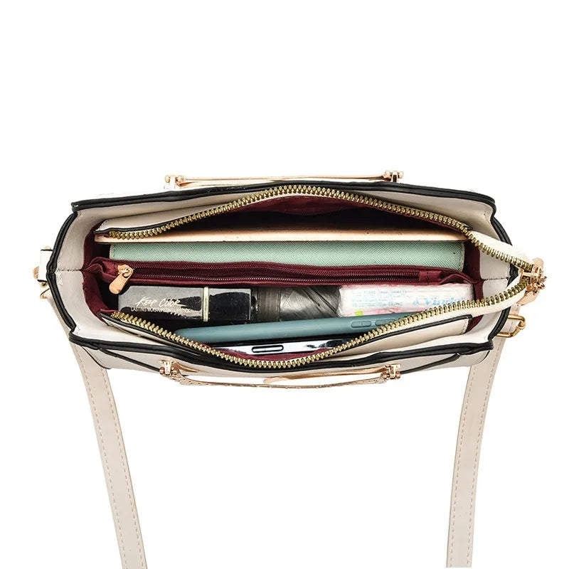 Open handbag with items inside on a white background