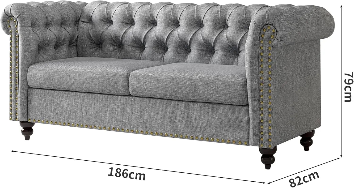 Gray tufted sofa with dimensions on a white background