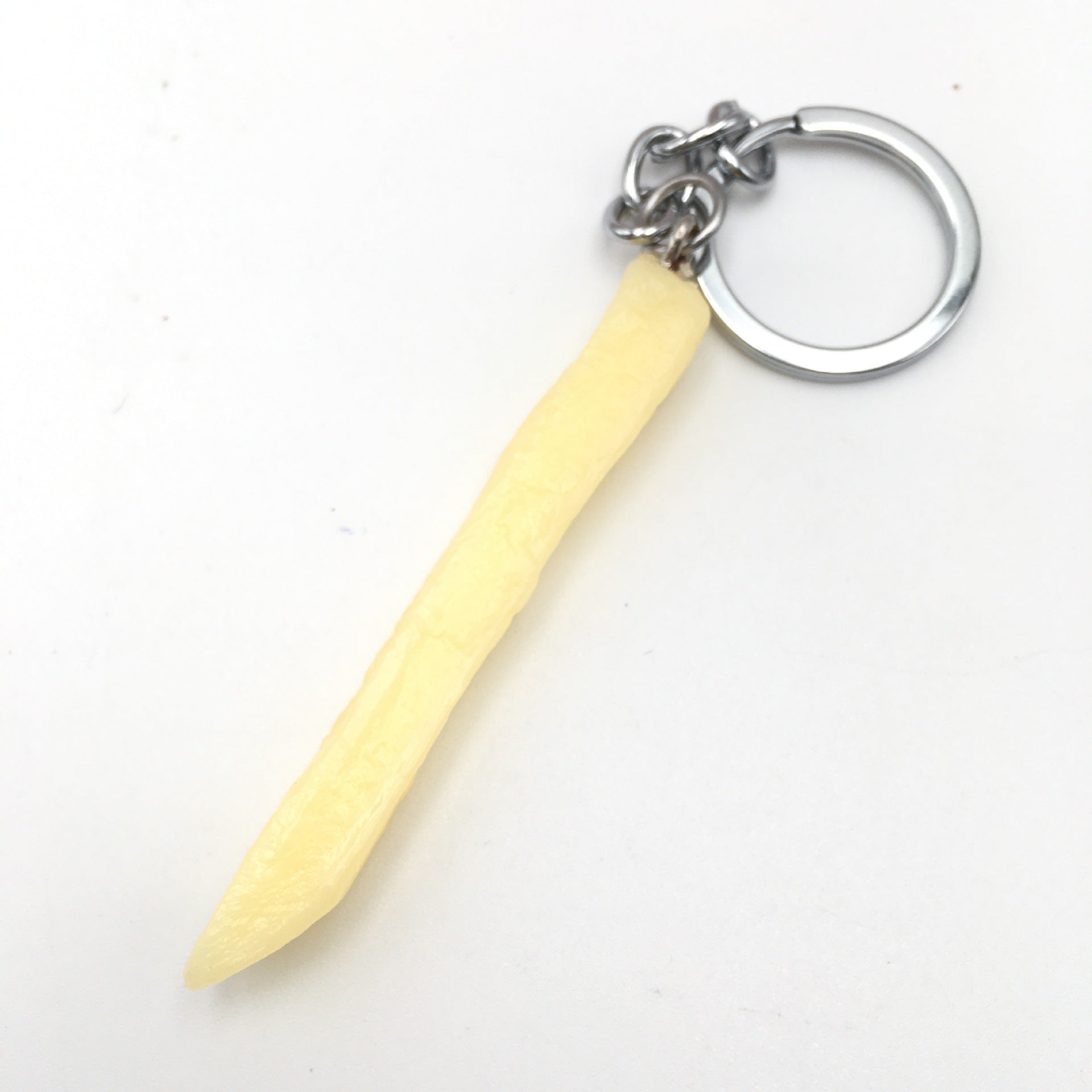 Chip French Fry Keychain with a yellow handle and silver ring on a white background
