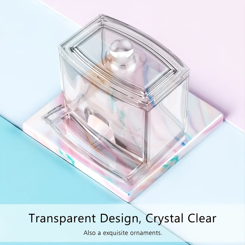 Clear glass container with a lid on a pastel background