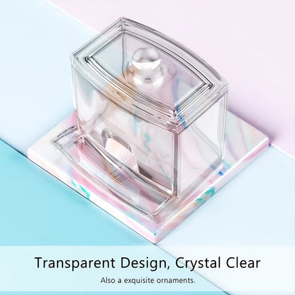 Clear glass container with a lid on a pastel background
