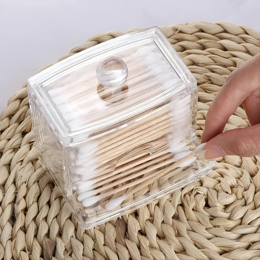 Clear container with cotton swabs on a woven surface