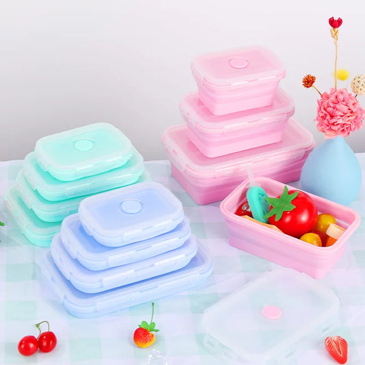 Set of colorful silicone containers on a light background with decorative elements.