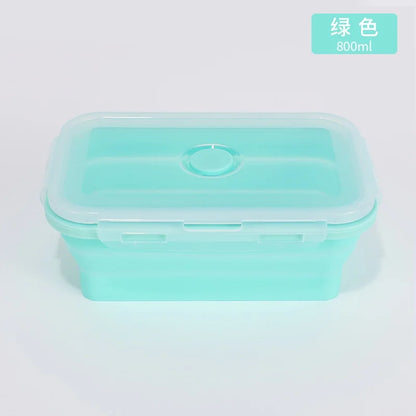 Green silicone container with a lid on a light gray background