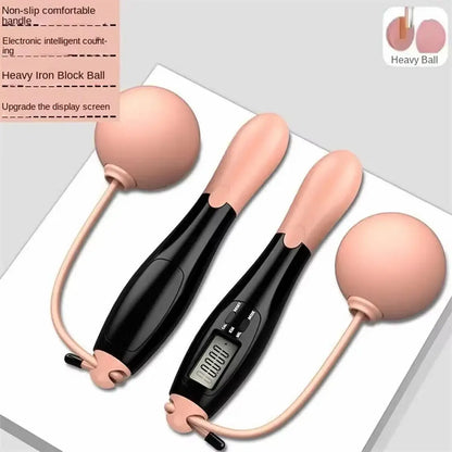 Black electronic device with pink attachments on a white background