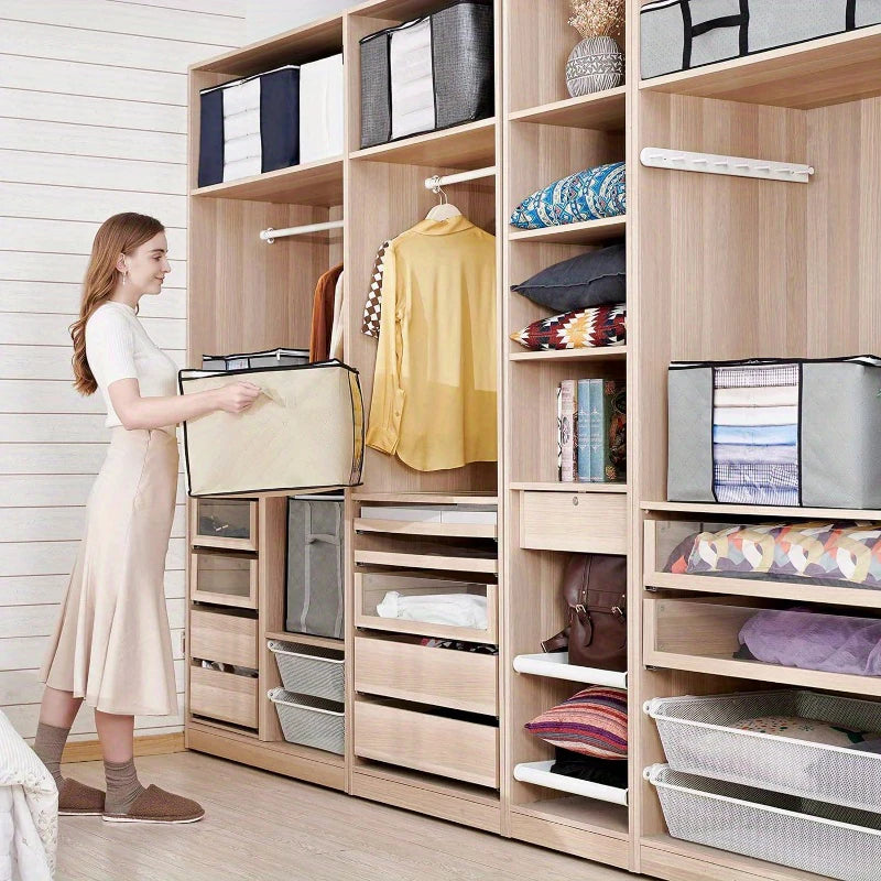 Woman organizing a wooden wardrobe with shelves and storage bins.