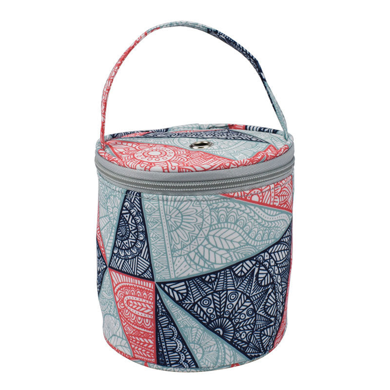 Patterned cooler bag with a handle on a white background