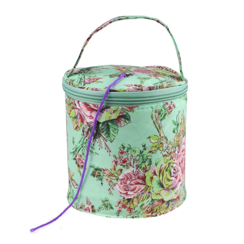 Floral-patterned cylindrical bag with a purple拉链 on a white background