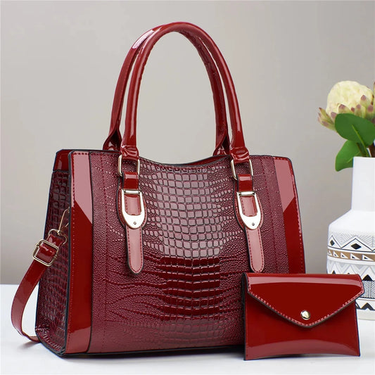 Red handbag with matching wallet on a light gray background