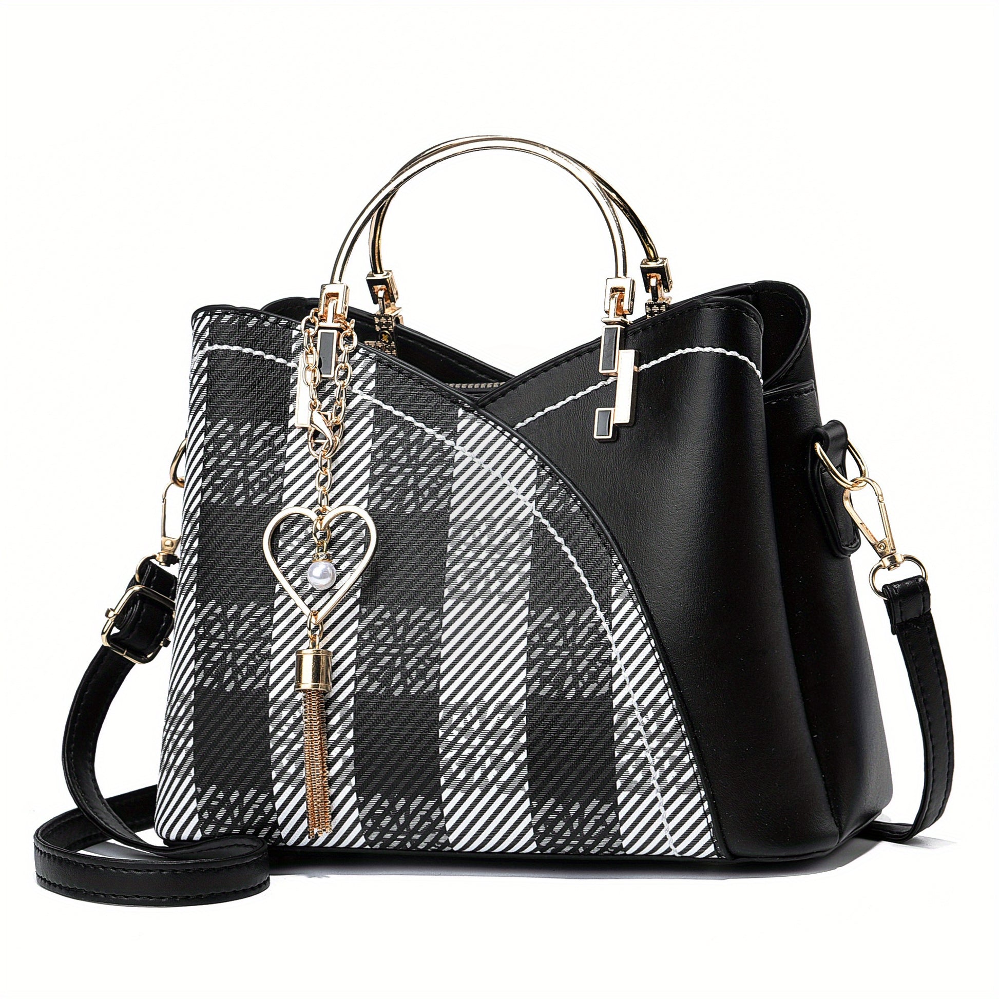 Black and white plaid handbag with gold accents on a white background