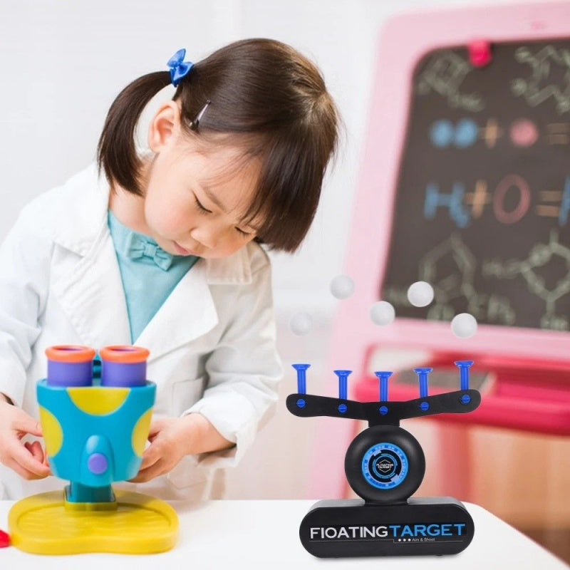 Child playing with a science-themed toy set in a classroom setting