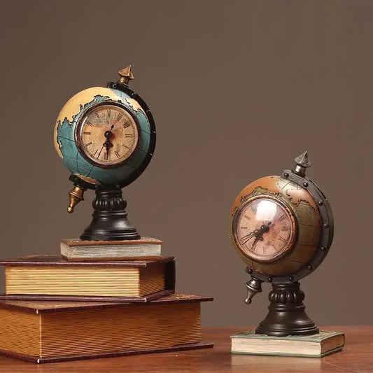 Two decorative clocks resembling globes on books against a brown background