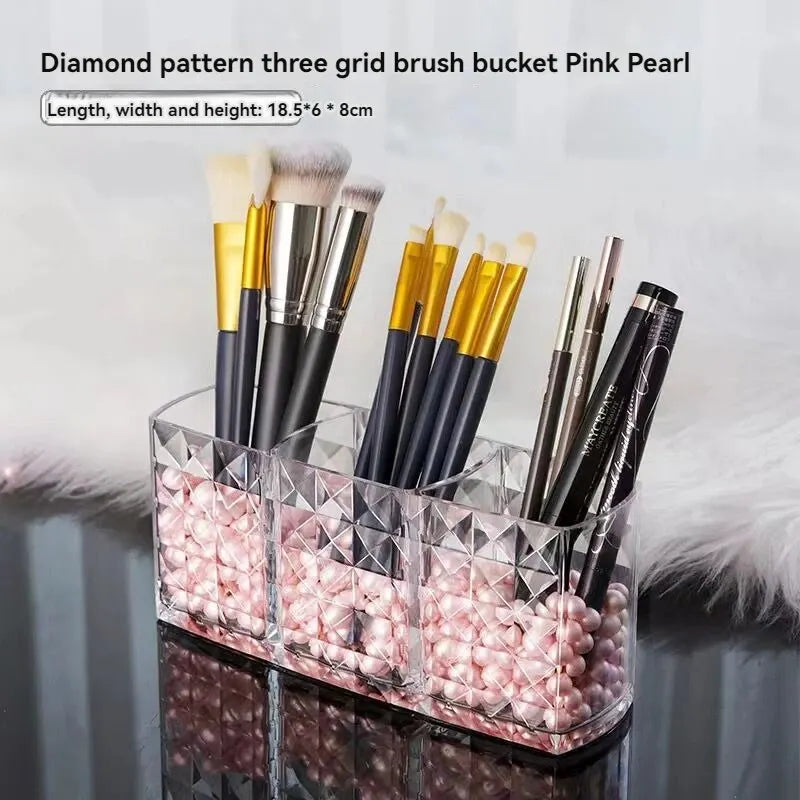 Makeup brush holder with diamond pattern and pink beads on a light gray background