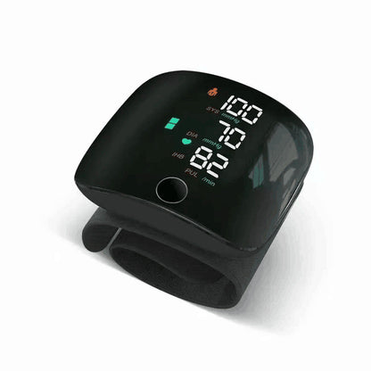 Black digital blood pressure monitor on a white background