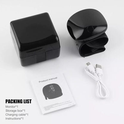 Black electronic device with packaging, charging cable, and product manual on a white background
