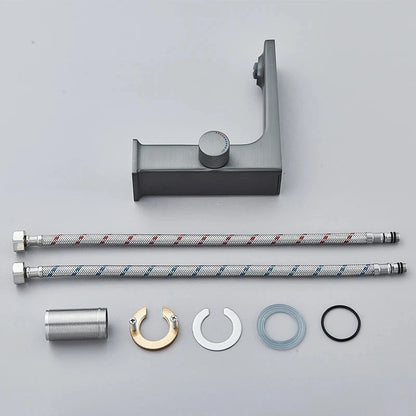 Set of plumbing components including a shower arm, brackets, and washers on a gray background