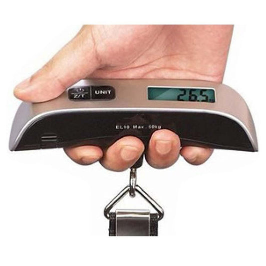 Digital luggage scale held in a hand with a white background