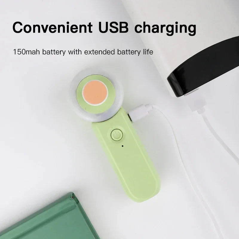 Green handheld device with USB charging feature on a white background