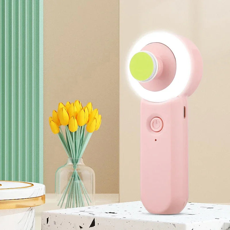 Pink ring light on a surface with yellow tulips in the background