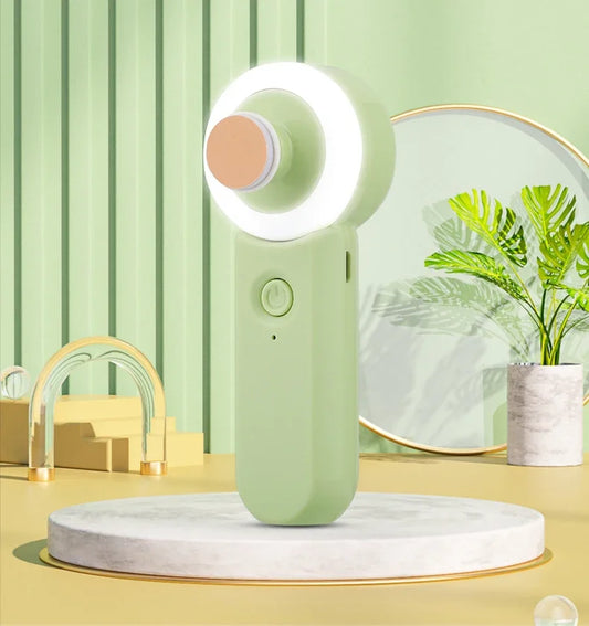 Nail trimmer with a round light on a marble platform against a green curtain background