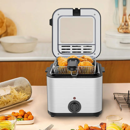 Small electric deep fryer with fried food on a kitchen counter