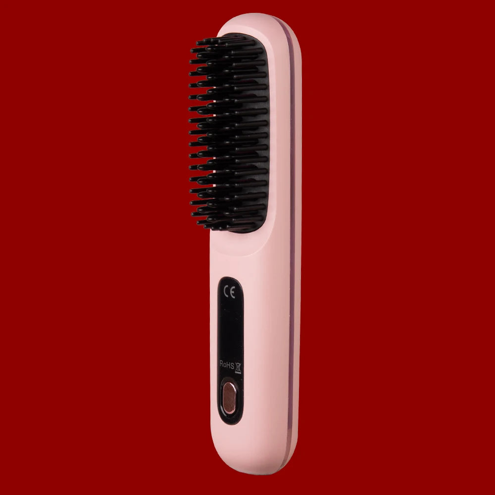 Pink hair straightening brush with black bristle head on a red background