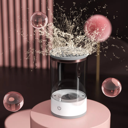 Transparent container with water splashes and bubbles on a dark background