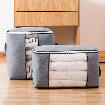 Two gray storage bags with quilted texture on a wooden floor.