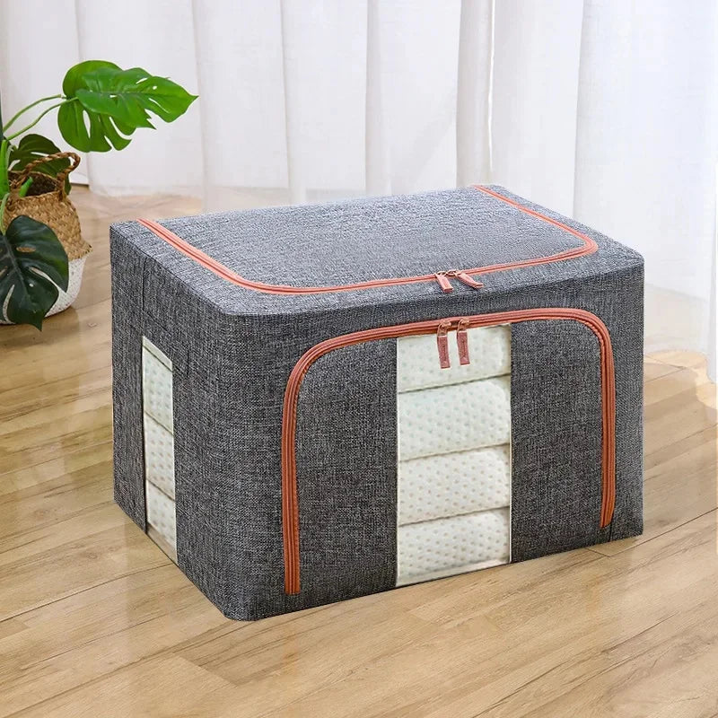 Gray storage ottoman with orange zipper on a wooden floor