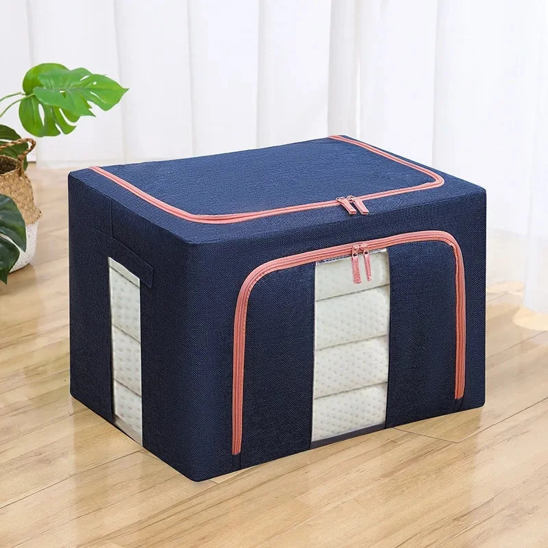 Navy storage box with pink zipper on a wooden floor