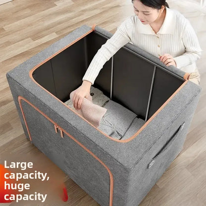 Person interacting with a large gray storage ottoman on a wooden floor.
