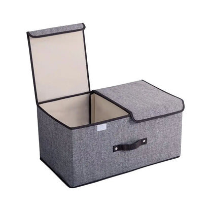 Gray storage ottoman with a beige interior on a white background