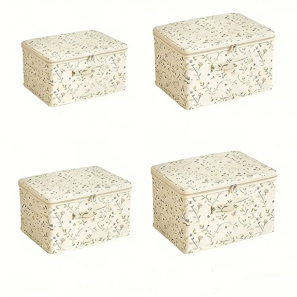 Four decorative storage boxes with floral patterns on a white background