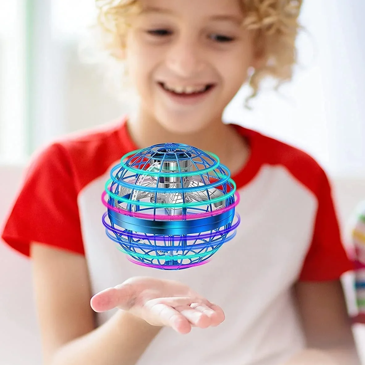 Child holding a colorful spinning ball toy