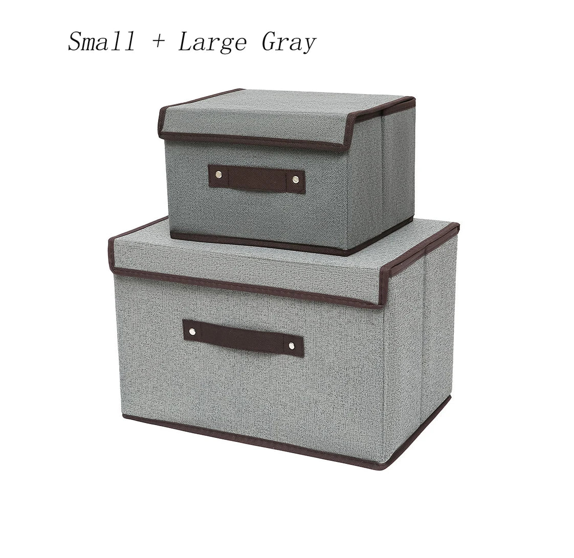 Two gray storage boxes with brown handles on a white background
