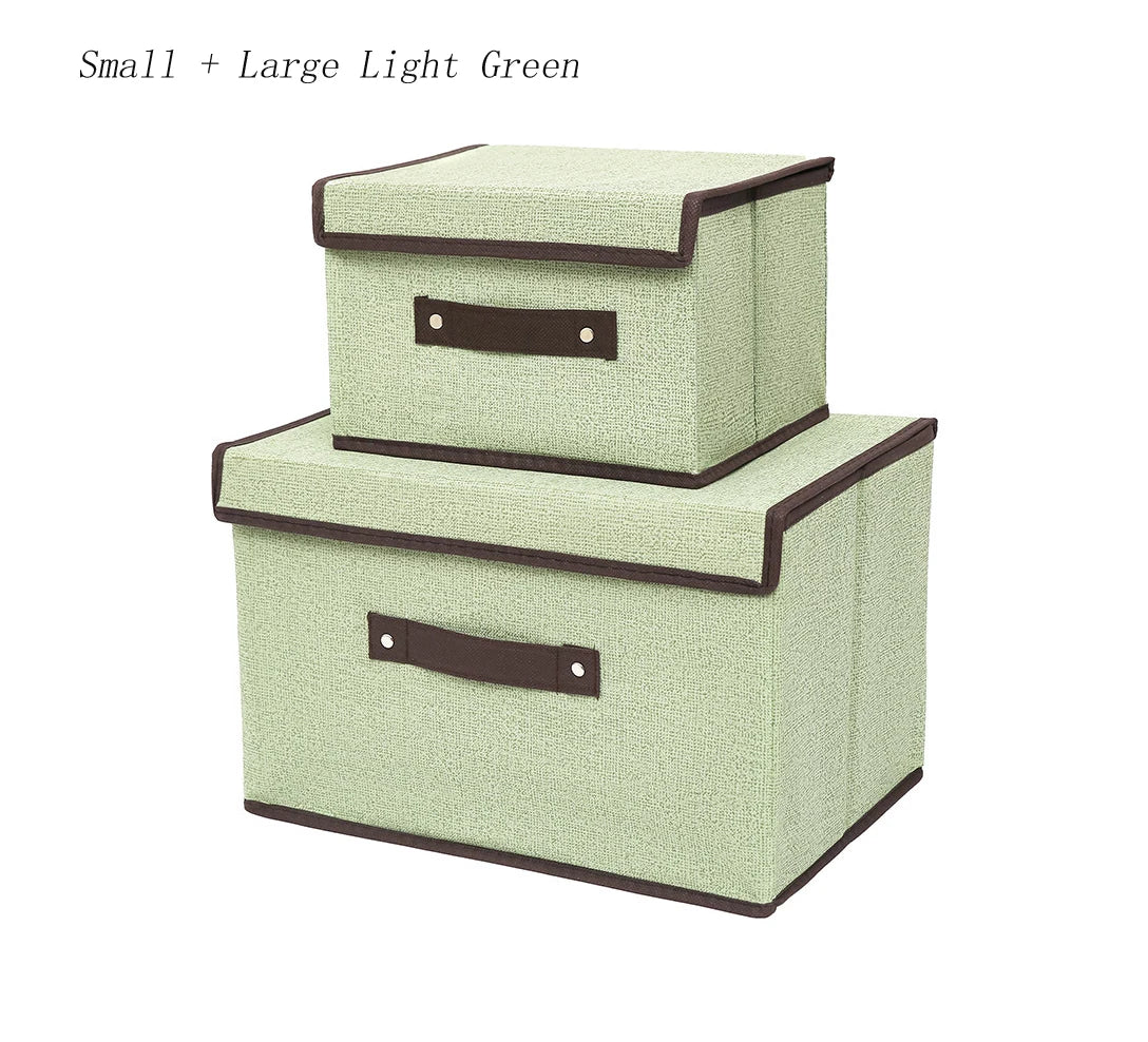 Two light green storage boxes with brown handles on a white background