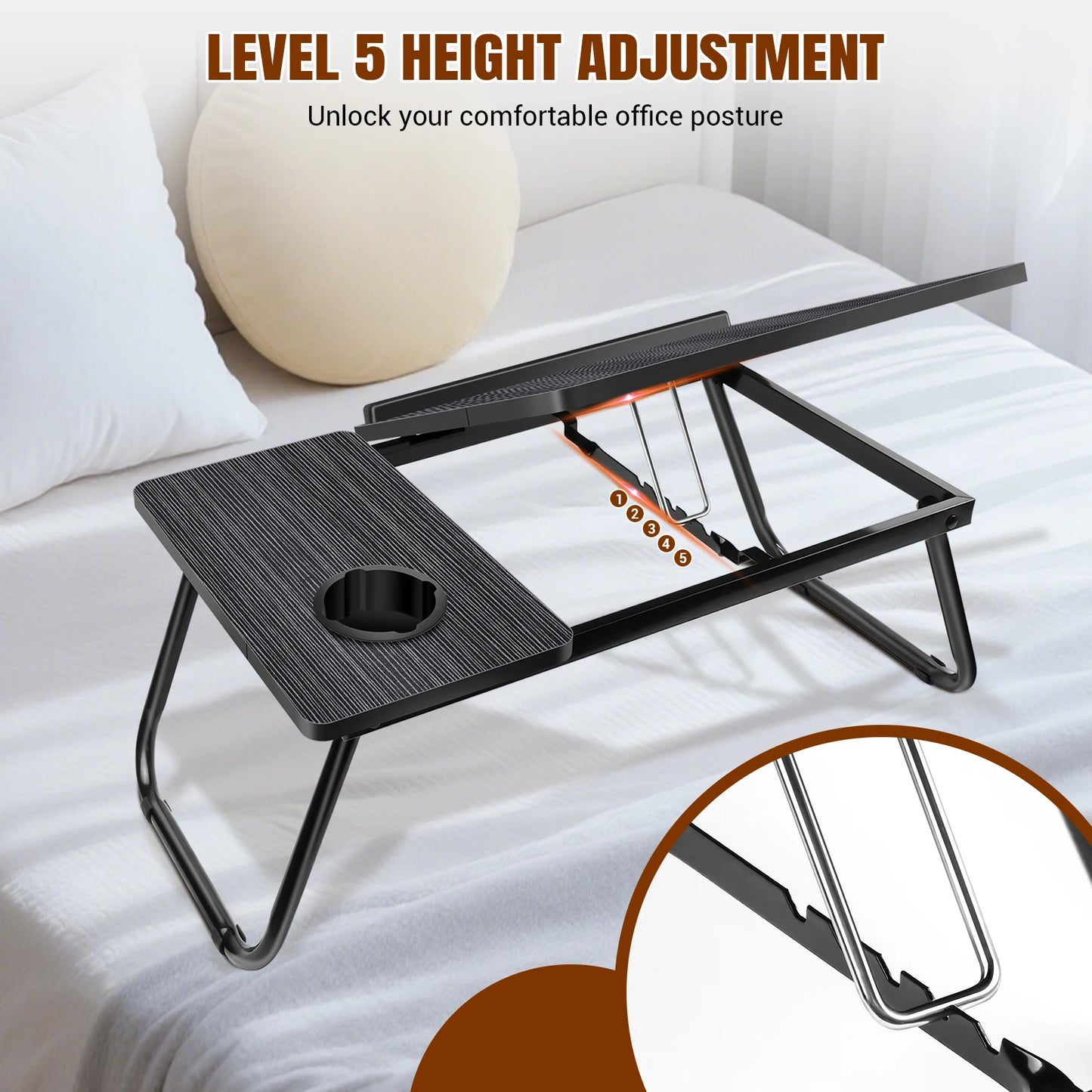 Foldable laptop desk with height adjustment feature on a bed