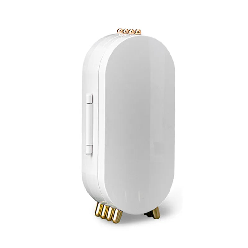 White electronic device with gold accents on a white background