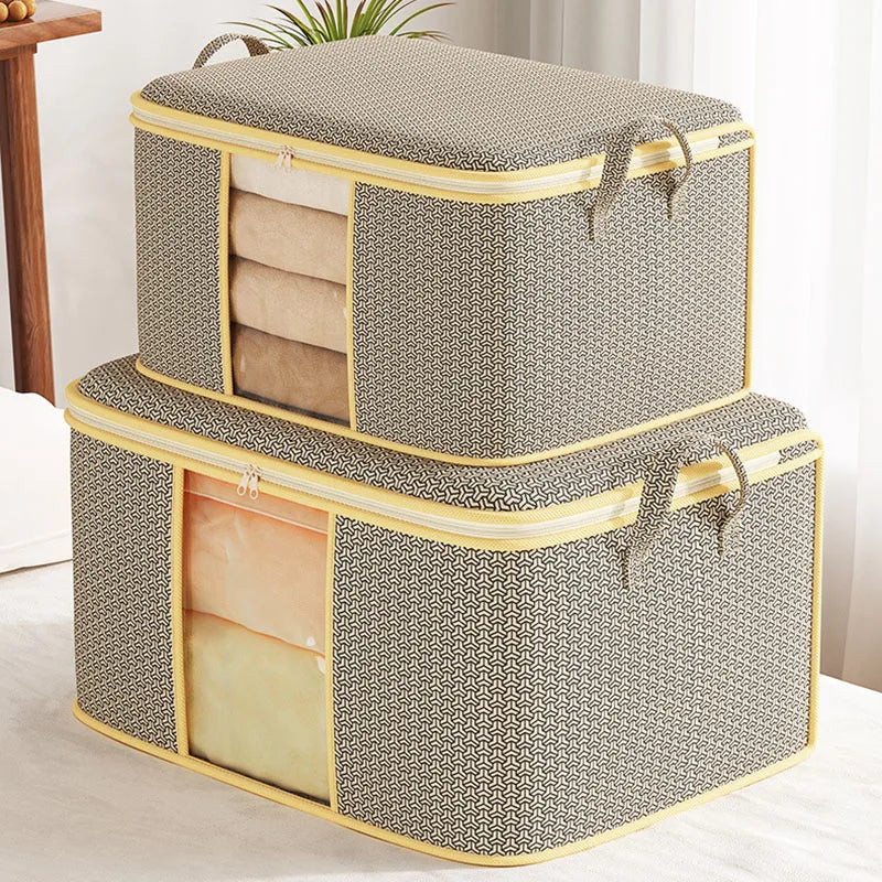 Two gray storage boxes with yellow trim on a light surface.