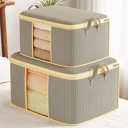 Two gray storage boxes with yellow trim on a light surface.