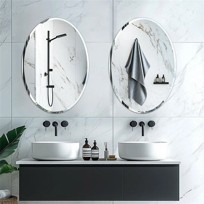 Modern bathroom with two oval mirrors, black fixtures, and white sinks.