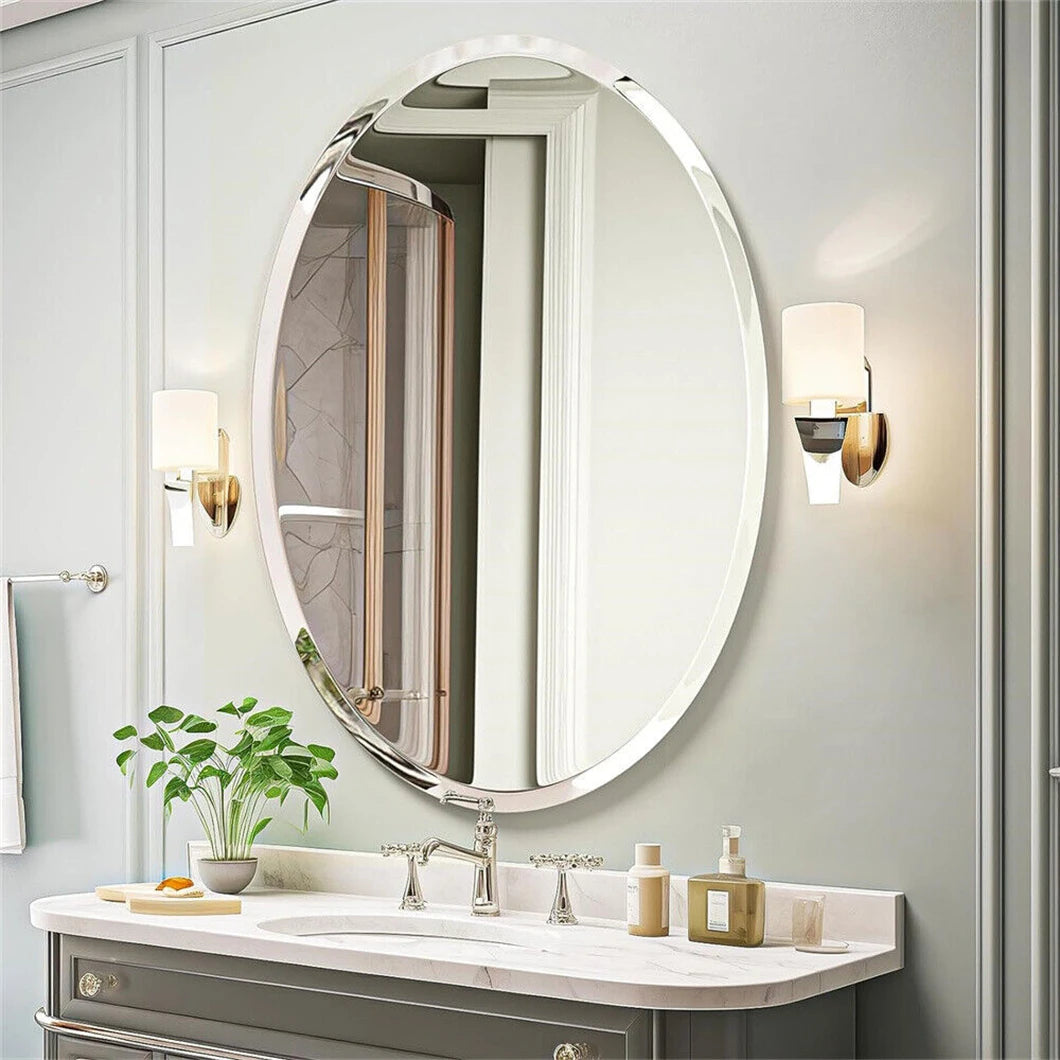 Bathroom vanity with round mirror, sink, and decorative items on a light gray wall.