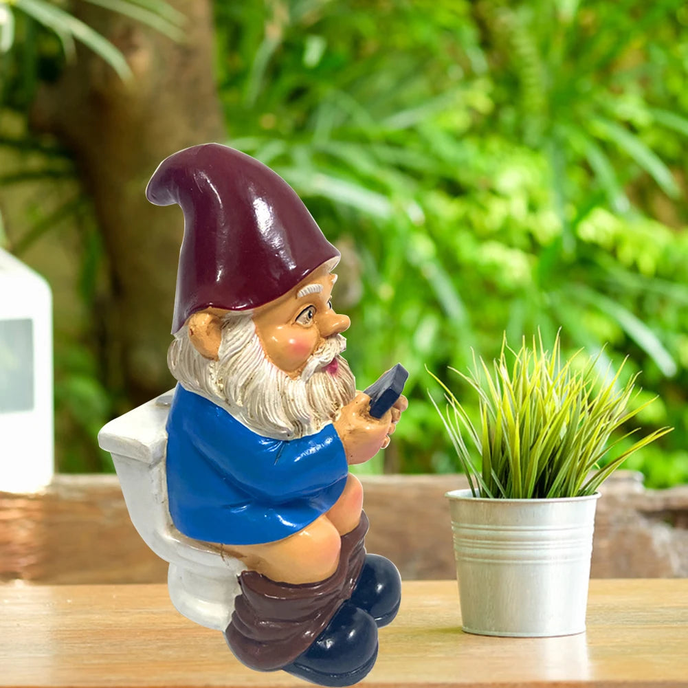 Gnome figurine using a smartphone on a wooden surface with greenery in the background