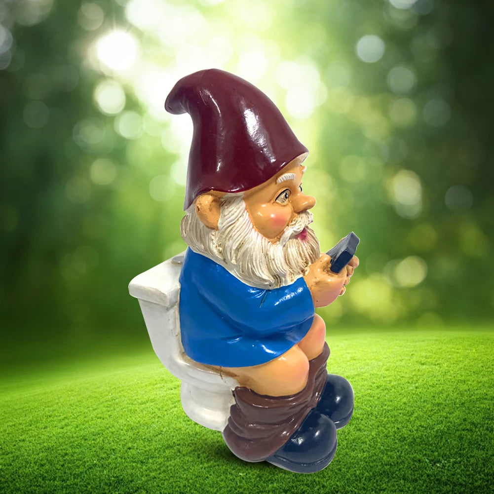 Gnome figurine using a smartphone on a grassy background
