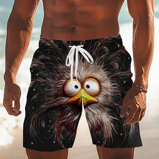 Person wearing a pair of shorts with a cartoonish owl design on a beach.