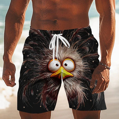 Person wearing a pair of shorts with a cartoonish owl design on a beach.