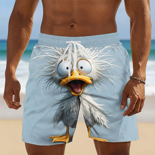 Person wearing a swimsuit with a cartoon eagle design on a beach.