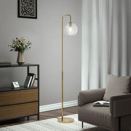 Modern living room with a floor lamp, sofa, and side table.
