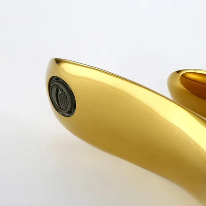 Gold electronic device with a black component on a white background