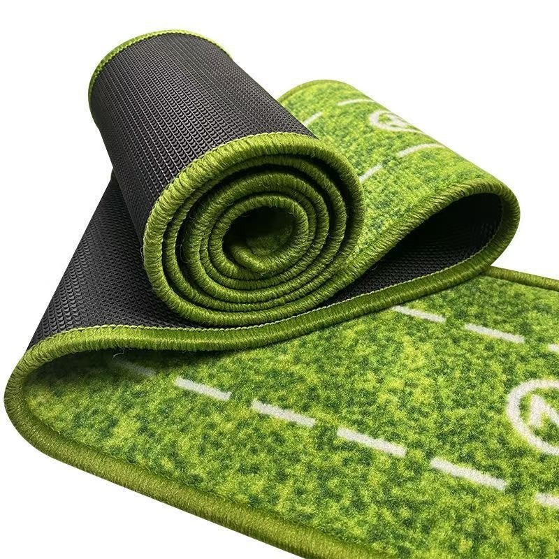 Green and black yoga mat with white lines on a white background